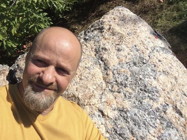 Kyle Russell in front of pyramidal Granite